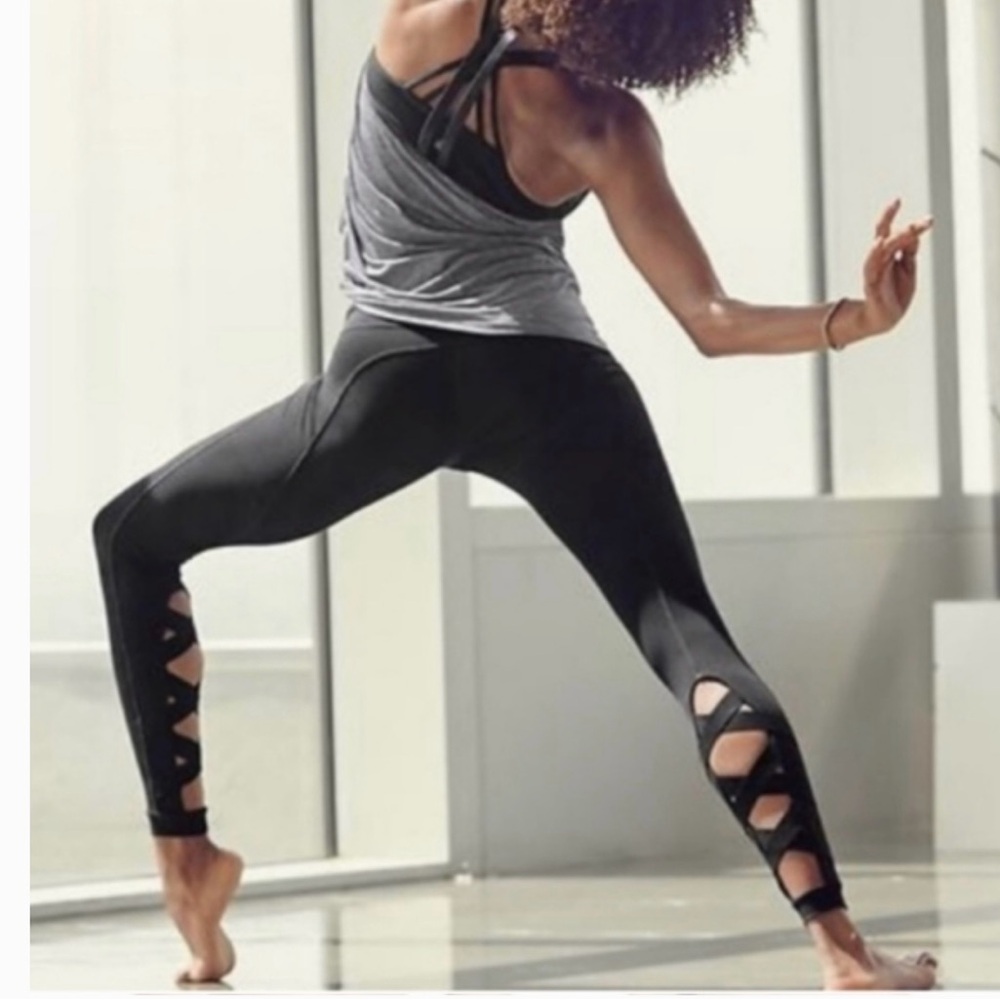 Athleta Brand Yoga Pants With Criss Cross Detail at Calf. Size S. Color Black.